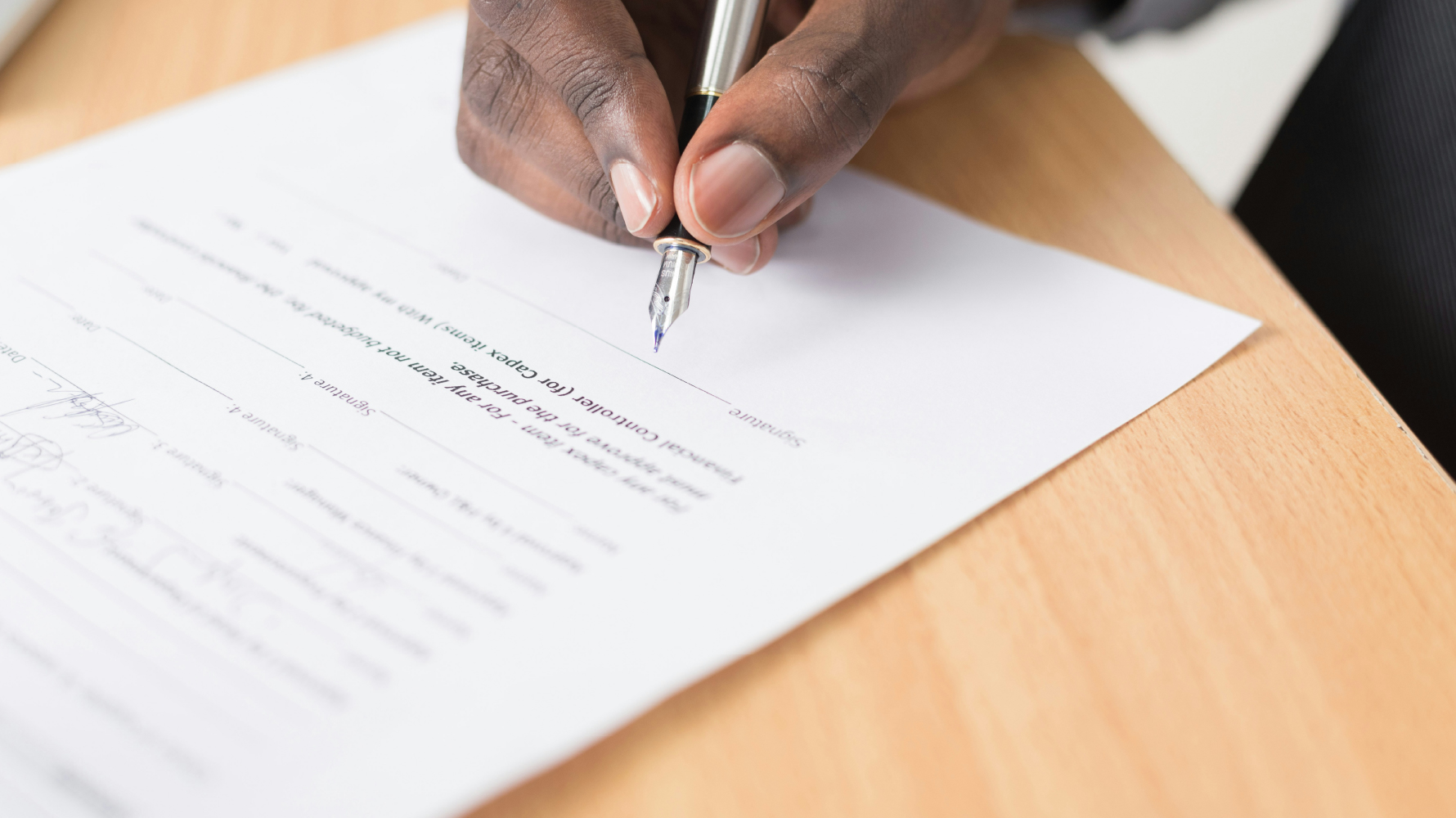 Man signing a legal contract